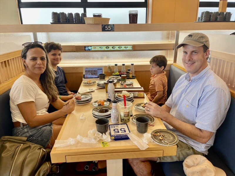 Enjoying a meal at a conveyor belt sushi restaurant